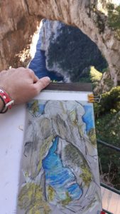 Student drawing at the Natural Arch