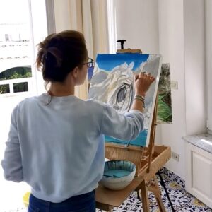 Painting at an easel